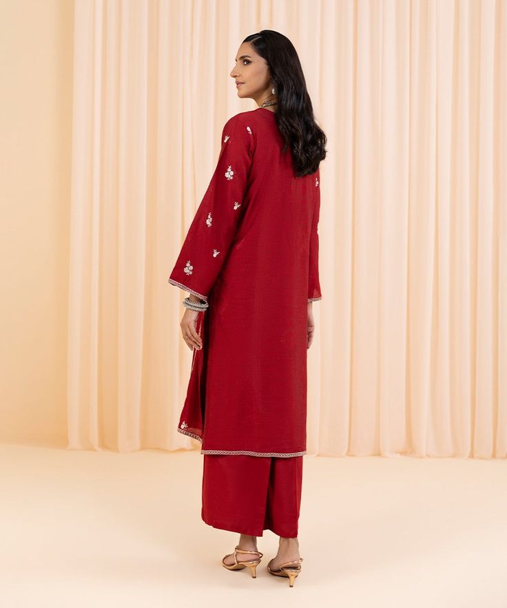 2-Piece Flared Angrakha with TrousersMake a fashionable statement in red flared angrakha featuring intricate embroidery and silk culottes. Details:Plain Front With Embroidery, Plain Back, Full Embroidered Sleeves, Y NecklineColour: RedFabric: Silk Cotton Net CulottesColour: RedFabric: Viscose Raw Silk Silk Culottes, Net Suit, Red Flare, Embroidered Sleeves, Red Dress Women, Intricate Embroidery, Silk Material, Raw Silk, Cotton Silk