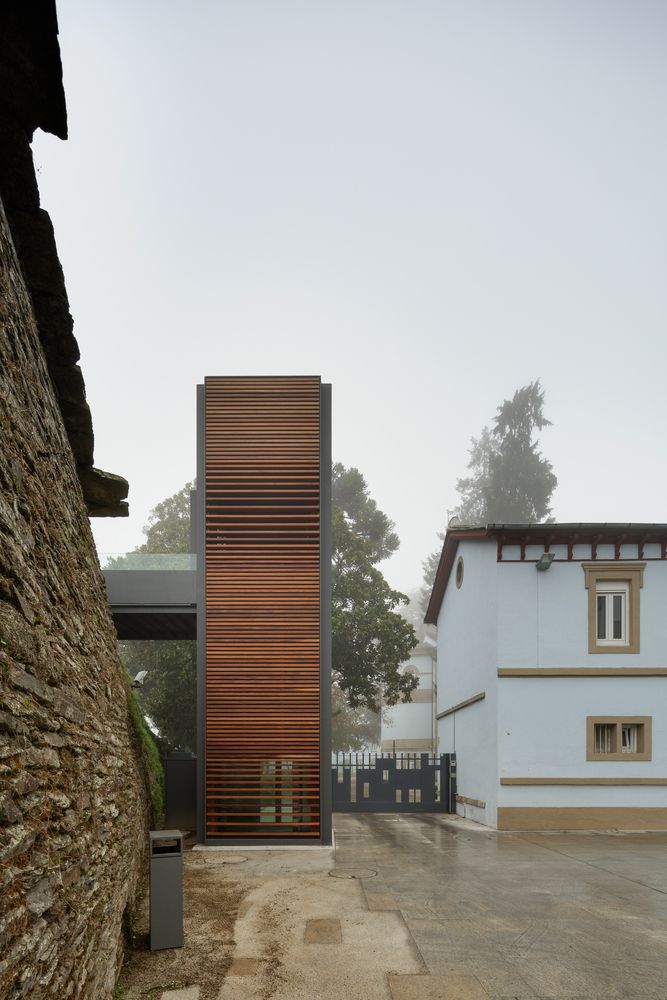 the building is made out of wood and has a wooden slatted door