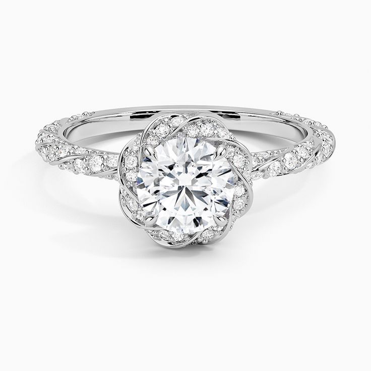 a white gold engagement ring with an intricate flower design on the shan shan shan shan shan shan shan shan shan shan shan shan shan shan shan shan shan shan shan shan shan shan shan shan shan shan shan shan shan shan