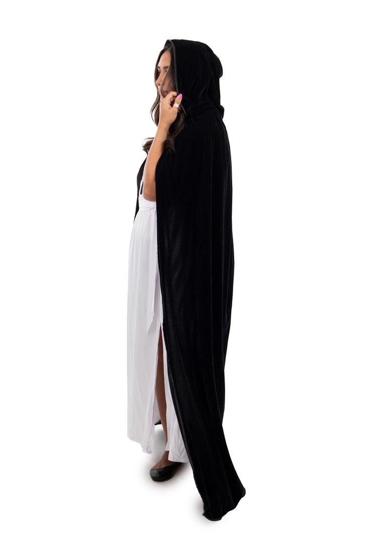 This full length Black Velvet Adult Cloak is perfect for a variety of dress up occasions; wear to any Halloween Party, Cosplay, Role Playing, Gothic, Steampunk, Renaissance, Medieval Events or a Masquerade Ball! Made from black velvet, measuring from 60.5" from neckline to hem Satin trimmed hood with ribbon tie closure Machine washable and made for repeat use Breathable, 100% Polyester Fabrics Costumes & accessories not included Gothic Cape Costume For Costume Party, Gothic Black Costume For Winter, Black Gothic Costume For Winter, Vampire Cape For Halloween Cosplay, Black Gothic Cape For Cosplay Events, Black Cape For Halloween Cosplay, Witchy Cape For Halloween Cosplay, Black Gothic Cape For Costume Party, Black Vampire Cape For Winter