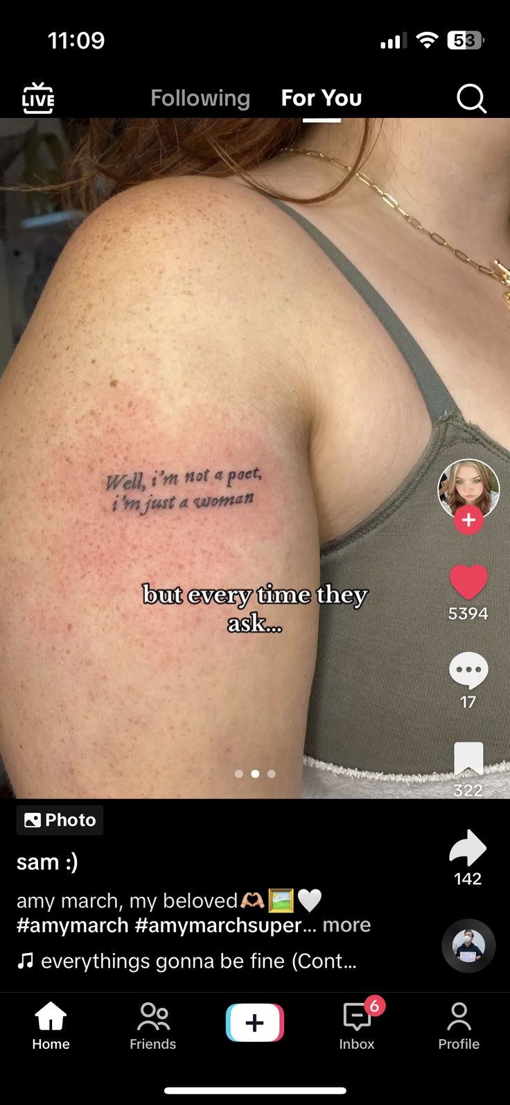 the back of a woman's arm with text on it