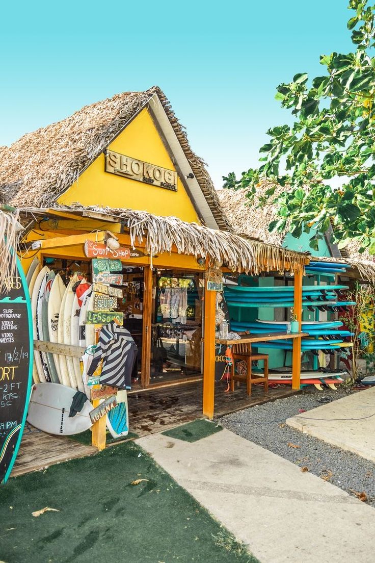 a store with surfboards on display in front of it