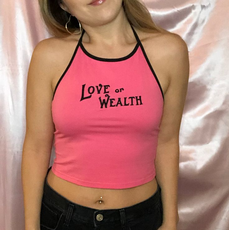 Very cute 90's style hot pink halter crop top with a moral dilemma. Hot pink halter crop top with black trim95% cotton 5% spandexSoft and stretchyCustom embroidered in the U.S.A., please allow for 3 additional days for production. Standard mannequin wears size S for all styles.This top is stretchy! For half sizes, we recommend that you downsize.Size S typically fits bust 30/32, waist 24/25. Pink Stretch Top For Streetwear, Trendy Pink Crop Top For Streetwear, Pink Fitted Y2k Crop Top, Fitted Pink Y2k Crop Top, Fitted Y2k Pink Crop Top, Pink Sleeveless Y2k Crop Top, Fitted Y2k Crop Top With Racerback, Y2k Stretch Halter Tank Top, Fitted Pink Crop Top For Streetwear