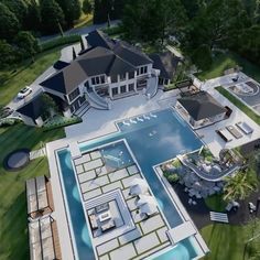 an aerial view of a house with a swimming pool