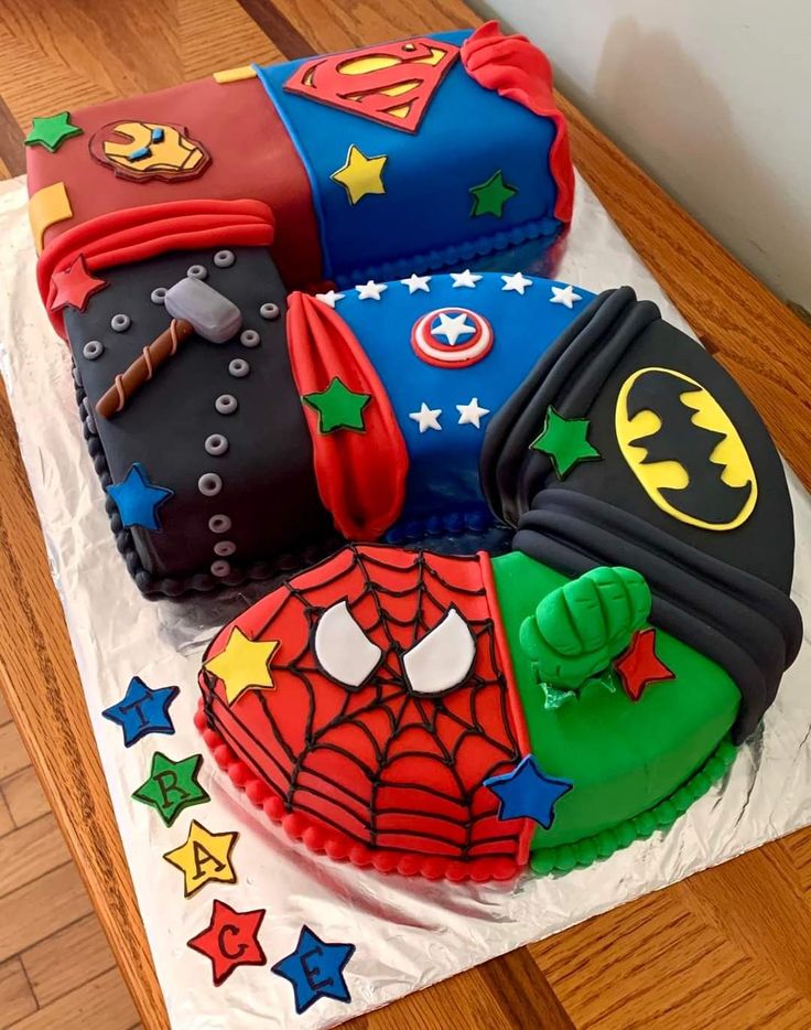 a birthday cake made to look like superheros