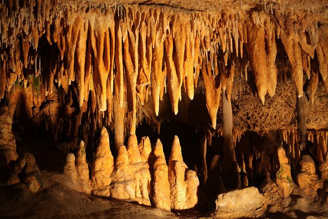 the inside of a cave with stalate formations