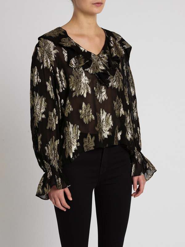 Make a statement in the labra top in black/gold by iro this season. constructed from a stunning viscose and lurex blend this long sleeved semi sheer blouse features billowy flared sleeves a floral print with a ruffle v neckline and is finished with a relaxed silhouette. pair with noir denim and leather boots for a feminine yet edgy vibe.    ---- fabric or composition    the iro labra top in black/gold is made from 70% viscose 30% lurex with 100% viscose lining    size and fit    the iro labra to Womens Printed Tops, Distressed Tee, Denim Flares, Sheer Blouse, Flared Sleeves, V Neckline, Print Tops, Leather Boots, Floral Print