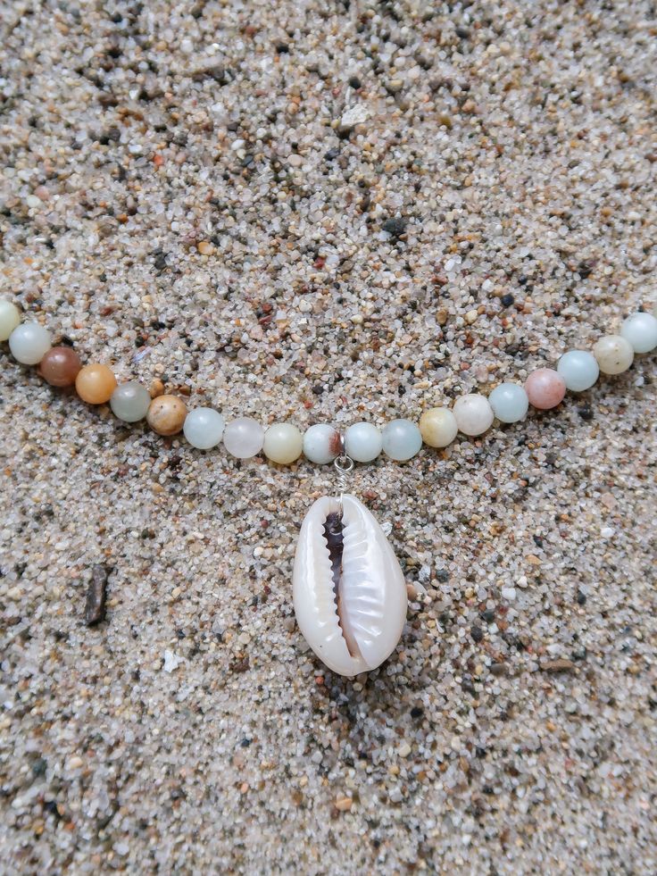 Originally founded as an arts colony, Laguna Beach is a mix of chill beach town and funky bohemian culture, offering some of the clearest blue water and the most relaxing days Southern California has to offer. MATERIALS blue and natural colored Amazonite with cowrie shell and natural wood on a 15" wire, finished with a 1.5" sterling silver extender chain with a ring clasp and tulip shell. Every stone is unique, which means that each bracelet is too. You can expect your jewelry to be one of a kin Bohemian Culture, Clear Blue Water, Cowrie Shell, Relaxing Day, Beach Town, Laguna Beach, Blue Water, Southern California, Natural Wood