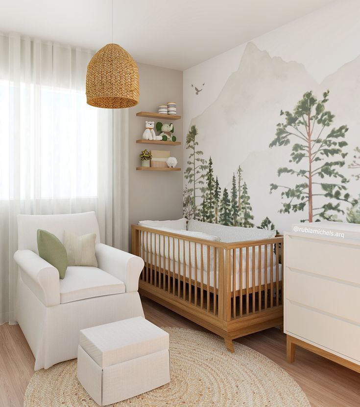 a baby's room with a crib, chair and wall mural in the background