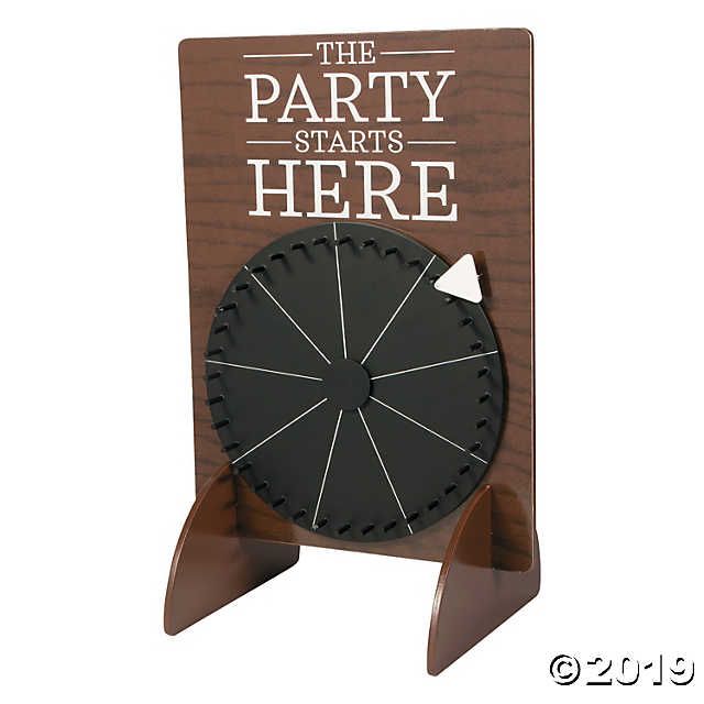 the party starts here sign is made out of wood and has an arrow on it