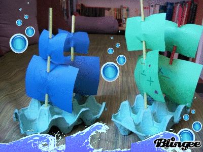 an image of a boat made out of paper on the floor with bubbles and water