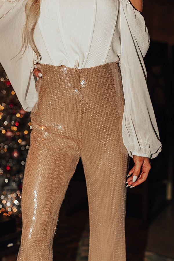 - Be the life of the party in these shimmering flares! - Fully lined sequin material - A stretchy elastic waistline - A flattering silhouette that ends in flared hemlines Measurements S : Front Rise 12", Hip 30", Inseam 32", Length 43.5", Waist 24-26". M : Front Rise 12.5", Hip 32", Inseam 32", Length 43.5", Waist 26-28". L : Front Rise 13", Hip 34", Inseam 33", Length 43.5", Waist 28-30". Holiday Sequined Wide-leg Bottoms, Holiday Sequin Wide-leg Bottoms, Chic High-waisted Sequin Pants, Luxury Sequined High-waisted Pants, High-waisted Sequin Stretch Pants, High Waisted, Luxury Fashion, Fashion Trends