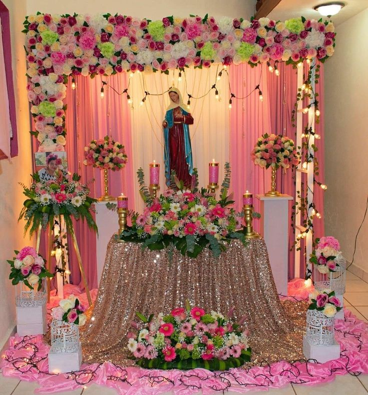 the altar is decorated with flowers, candles and an image of jesus on it's back