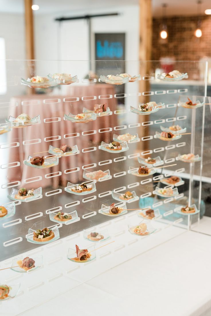 a display case filled with lots of small desserts