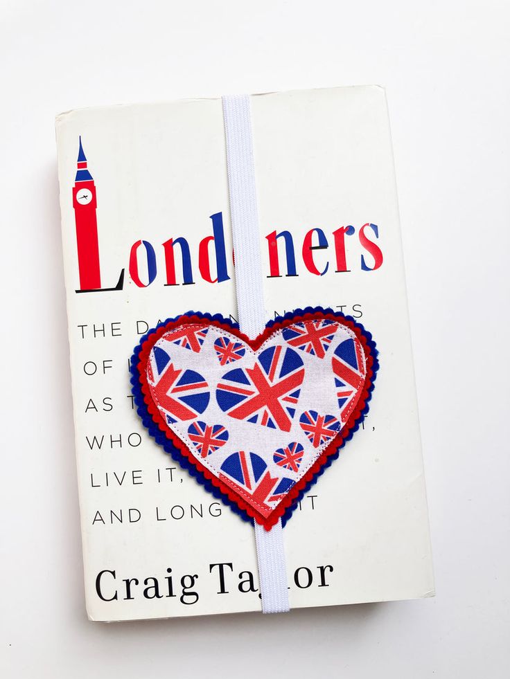 a book with a red, white and blue heart on it