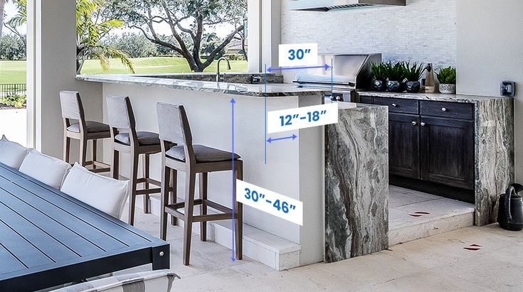 an open kitchen and dining room area with bar height measurements for the countertop, stools, and cabinets