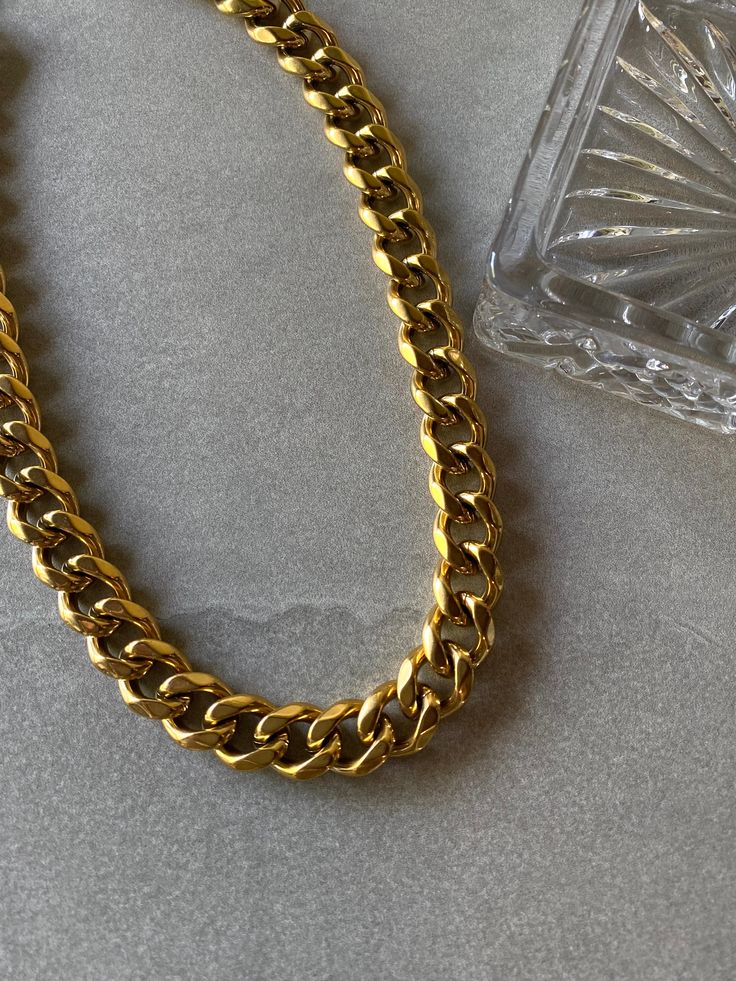 Chunky and trendy cuban link necklace. Pair with XL Cuban Link Bracelet for a complete matching look. -16" cuban link chain -12mm cuban links -18k gold plating over stainless steel -Waterproof, Tarnish resistant Cuban Link Bracelet, Cuban Link Necklace, Cuban Link Chain, Cuban Link, Link Necklace, Link Chain, Link Bracelets, Gold Plating, Rap