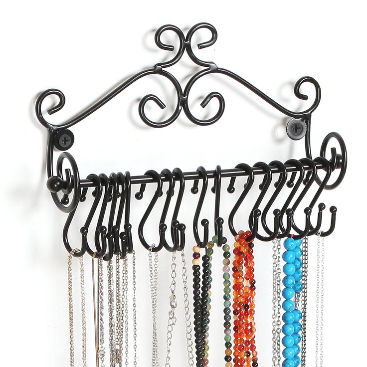 a rack with many different colored beads hanging from it's sides and hooks attached to the wall