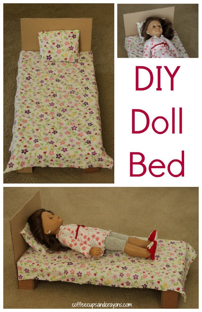 the doll is laying in her bed made out of cardboard