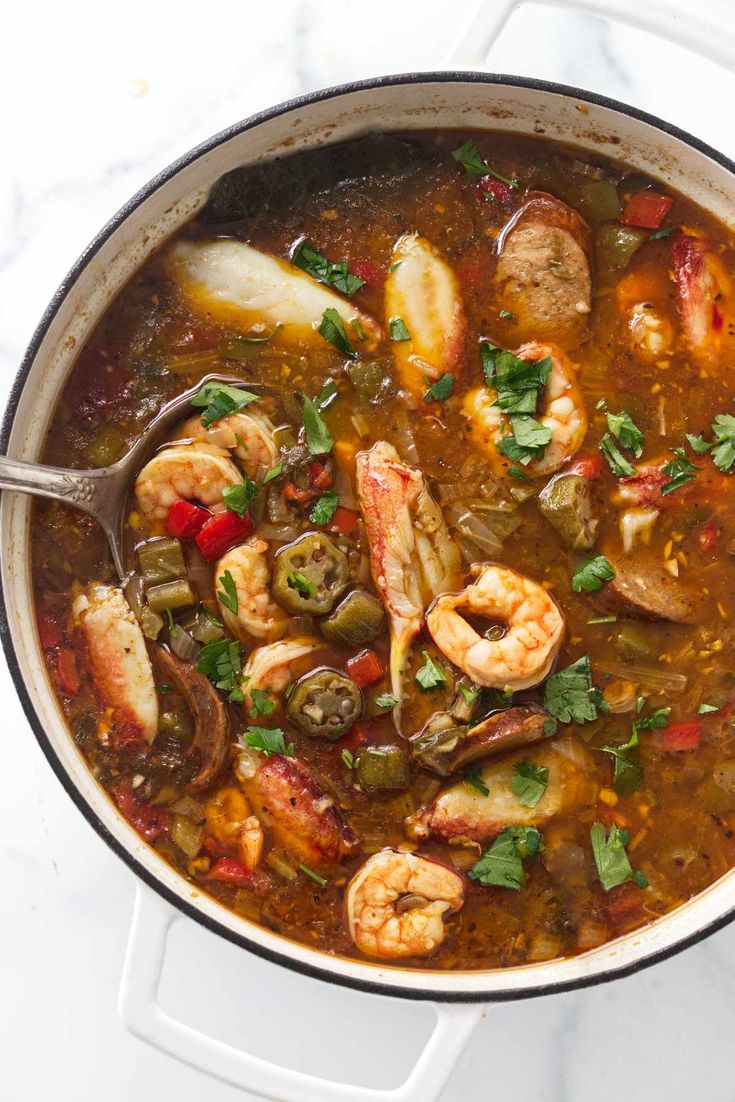 a large pot filled with seafood and vegetable soup