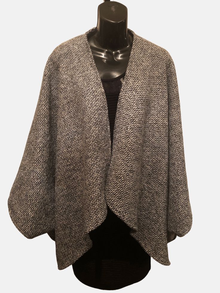 Wool and polyester blend Boucle Crop length Classic wrap with signature matching scarf. Handcrafted, Dry clean Chic Wool Poncho For Winter, Elegant Oversized Soft Knit Outerwear, Chic Wool Cape For Fall, Elegant Fall Poncho For Workwear, Elegant Fall Poncho For Work, Elegant Fall Workwear Poncho, Chic One-size Cape For Layering, Chic One Size Cape For Layering, Elegant One-size Wraps For Fall