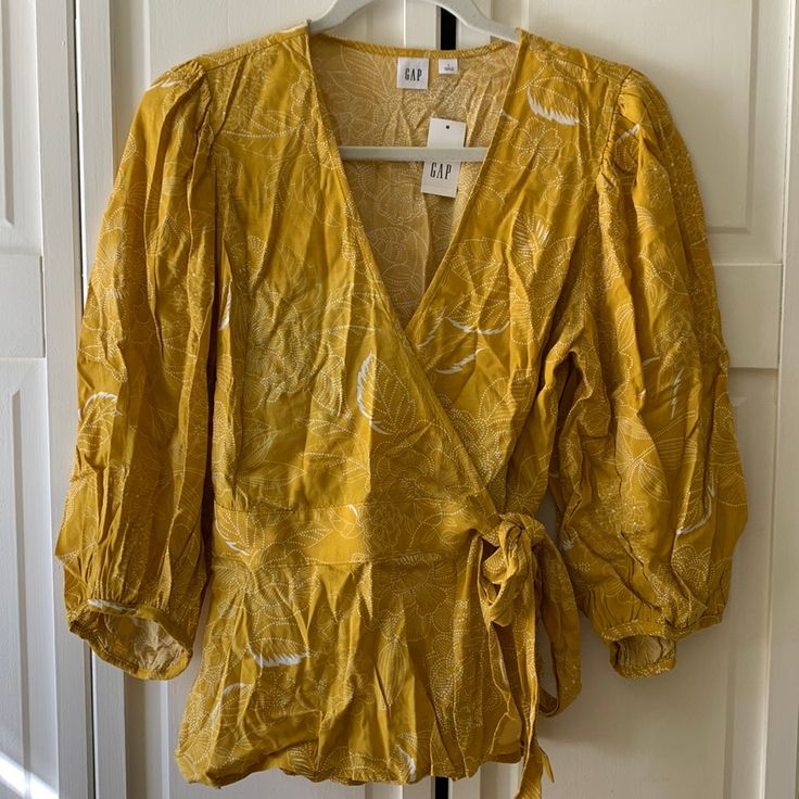 Yellow Tie Blouse Gap V-neck Summer Tops, Gap V-neck Tops For Spring, Yellow Cotton V-neck Blouse, Fitted Gap Tops For Summer, Yellow V-neck Blouse For Fall, Gap Summer Tops For Vacation, Gold V-neck Top For Beach, Gap Tops For Spring Vacation, Gold V-neck Beach Top