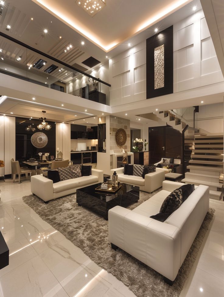 a living room filled with white furniture and lots of lights on top of the ceiling