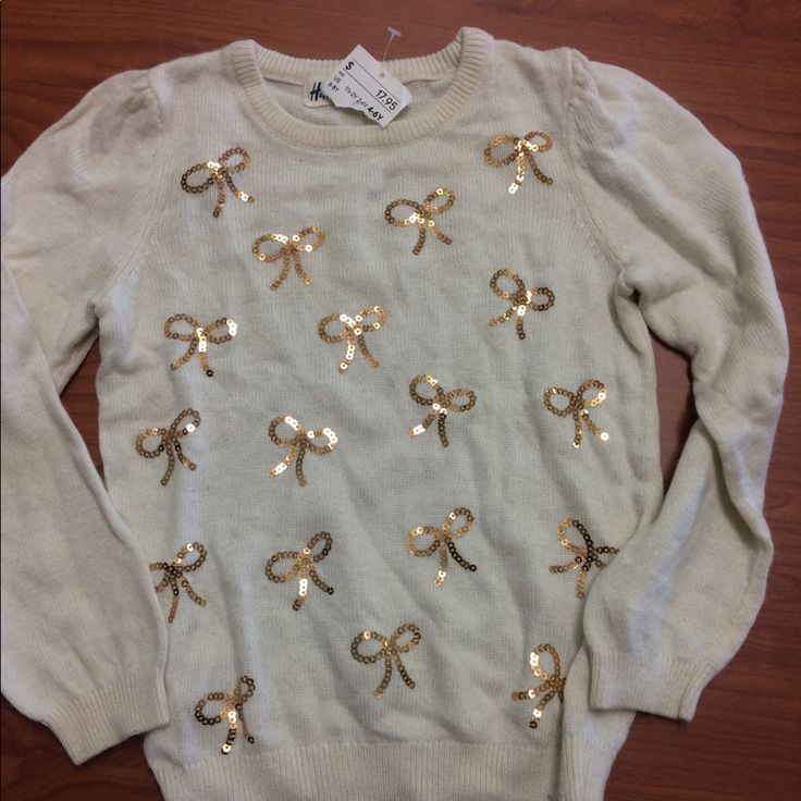 Nwt Adorable Cream And Gold Bow Sweater. Perfect For The Holidays Cute Cream Top For Fall, Cute H&m Crew Neck Top, H&m White Winter Sweater, Cute Beige Winter Tops, H&m Cotton Tops For Fall, Cute Holiday Tops For Spring, Beige Long Sleeve Sweater From H&m, Cute Tops For Spring Holiday, Cute Spring Holiday Tops