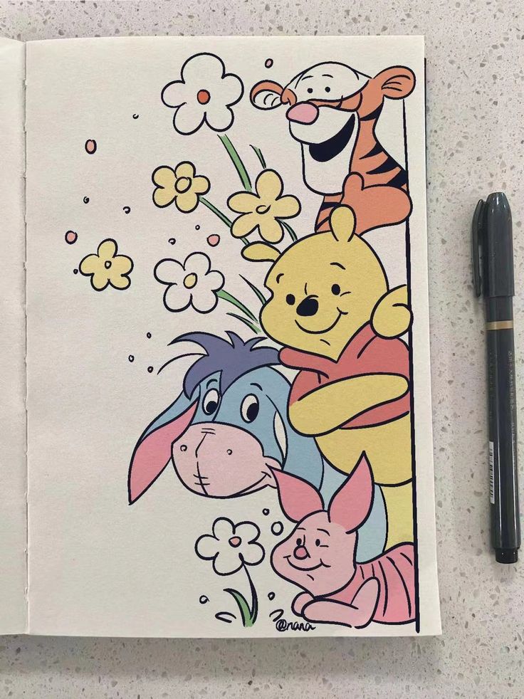 an open notebook with winnie the pooh and friends on it