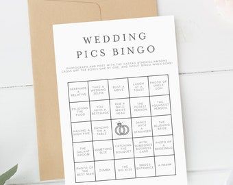 a card with a wedding pics bingo on it next to some flowers and an envelope