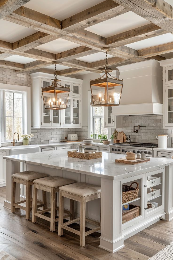 a large kitchen with an island and two stools in the center, surrounded by wooden beams