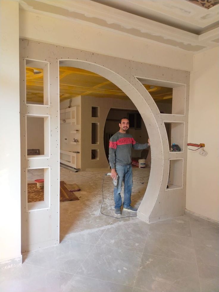 a man is standing in the middle of a room that has been built into it