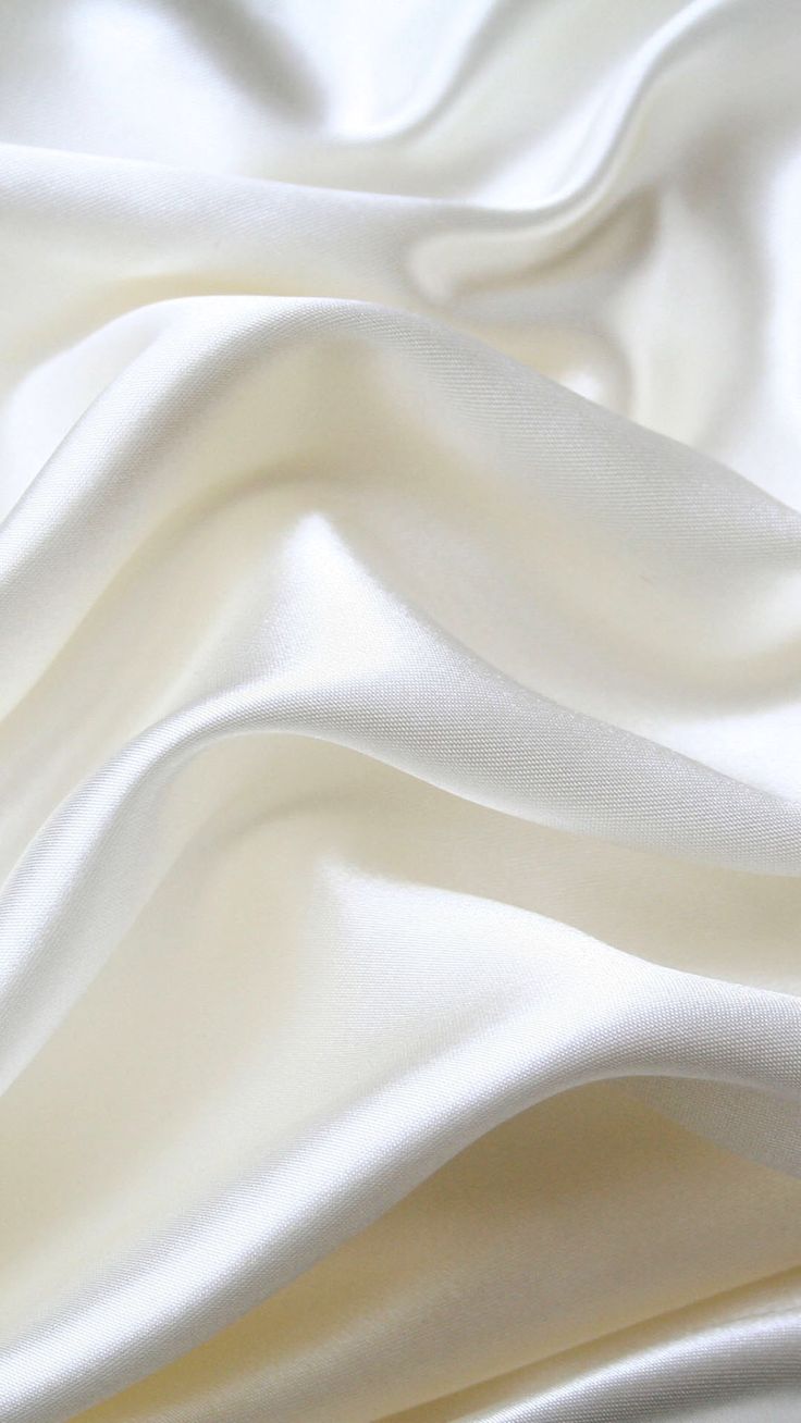 the white fabric is very soft and smooth, but it doesn't look like silk