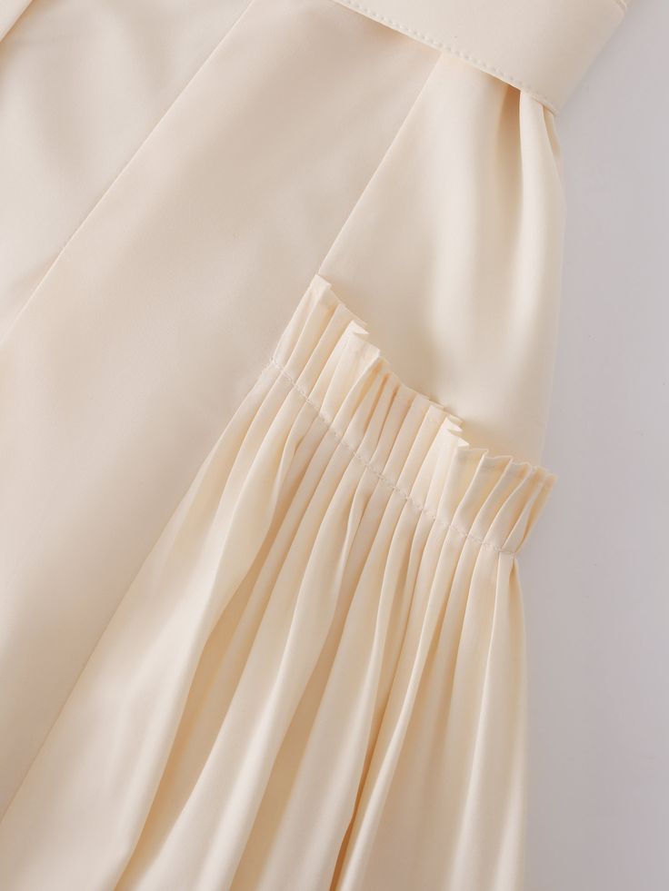 This Pintuck Pocket Skirt in Ivory is the perfect addition to any wardrobe. The unique pintuck detailing adds texture and sophistication to the classic A-line silhouette. Spring Silk Skirt With Pleated Waist, Chic Silk Skirt With Ruffles, Chic Silk Skirt With Accordion Pleats, Chic Pleated Ruffled Flowy Skirt, Feminine Cream Mini Skirt, Cream Pleated Tiered Skirt, Feminine Cream Pleated Skirt, Feminine Cream Flared Skirt, Feminine Long Skirt Beige Dress