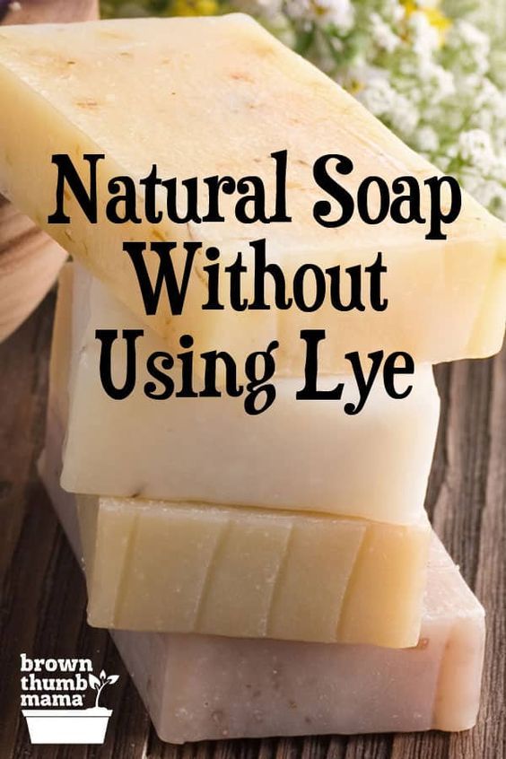 a bar of soap with the words make soap without using lye on it next to some flowers