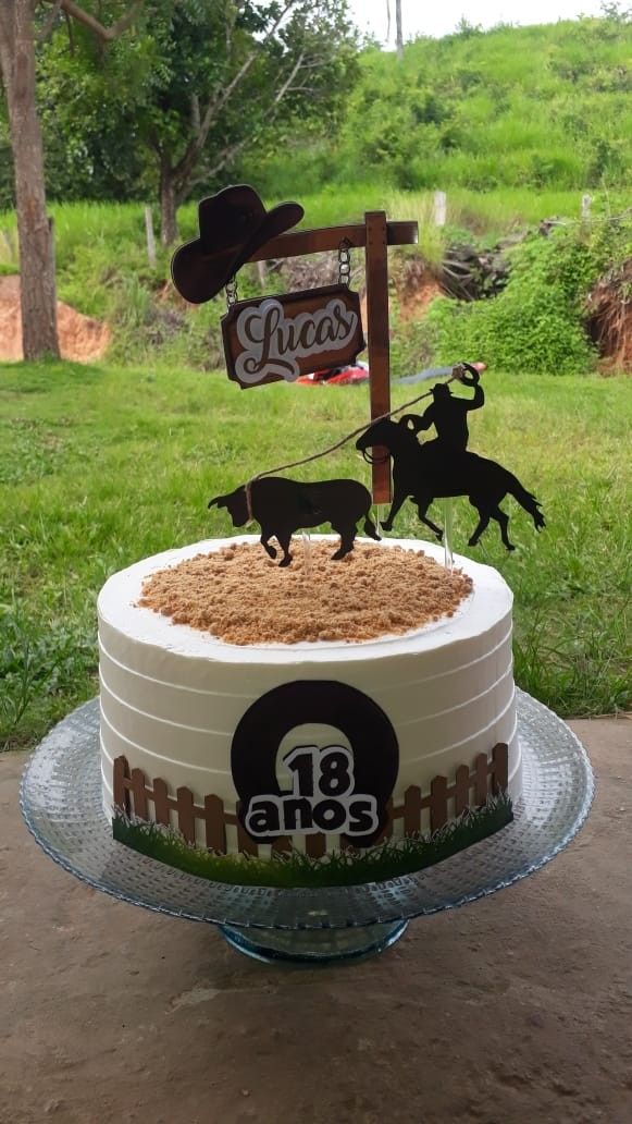 a birthday cake decorated with an image of a cowboy riding a horse