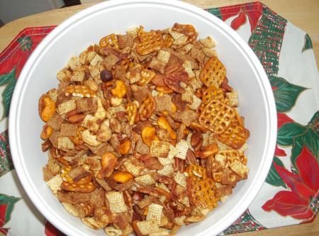 a white bowl filled with cereal and nuts