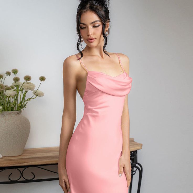 Features: Introducing our Spaghetti Satin Long Dress for women - the perfect addition to your wardrobe. This backless, pleated dress features a sexy high waist design and a halter neckline, making it the ideal choice for any elegant party look. Made with high-quality satin material, this dress is both comfortable and stylish. Elevate your fashion game with this must-have piece. Elegant Backless Midi Dress With Built-in Bra, Elegant Strapless Dress With Built-in Bra For Night Out, Backless Party Midi Dress With Built-in Bra, Elegant Sleeveless Backless Dress With Built-in Bra, Chic Halter Neck Dress With Built-in Bra, Backless Midi Dress With Built-in Bra For Date Night, Elegant Backless Halter Neck Dress With Built-in Bra, Chic Backless Dress With Spaghetti Straps And Built-in Bra, Elegant Backless Mini Dress With Delicate Straps