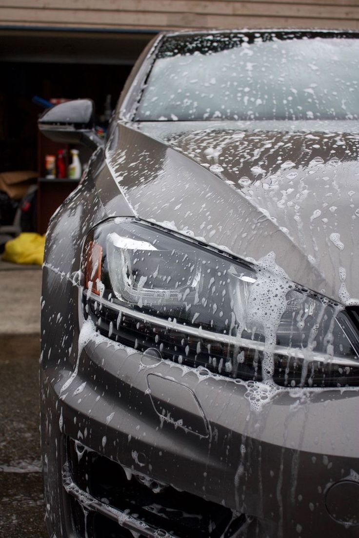 the front end of a car covered in water