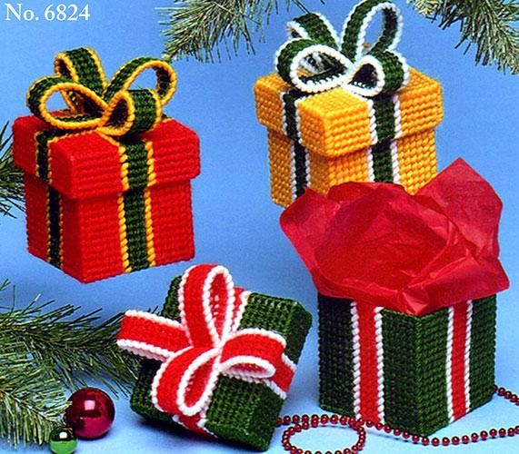 three small presents are wrapped in red, yellow and green ribbon