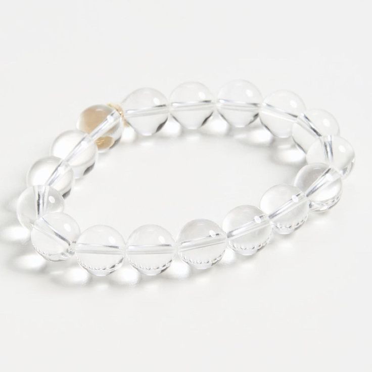 Our elegant glass bracelet adds a touch of class to any outfit. The perfect accessory for any occasion. Feel fabulous wearing this timeless piece. Transparent glass beads Elastic band Sterling with Gold Plate Transparent Beads Bracelet, Adjustable Clear Bangle Jewelry, Adjustable Clear Bangle Bracelets, Adjustable Clear Bangle Bracelet, Elegant Adjustable Crystal Stretch Bracelet, Elegant Clear Beaded Bracelets With Adjustable Fit, Elegant Adjustable Clear Beaded Bracelets, Elegant Crystal Stretch Bracelet For Gift, Elegant Adjustable Glass Crystal Bracelet