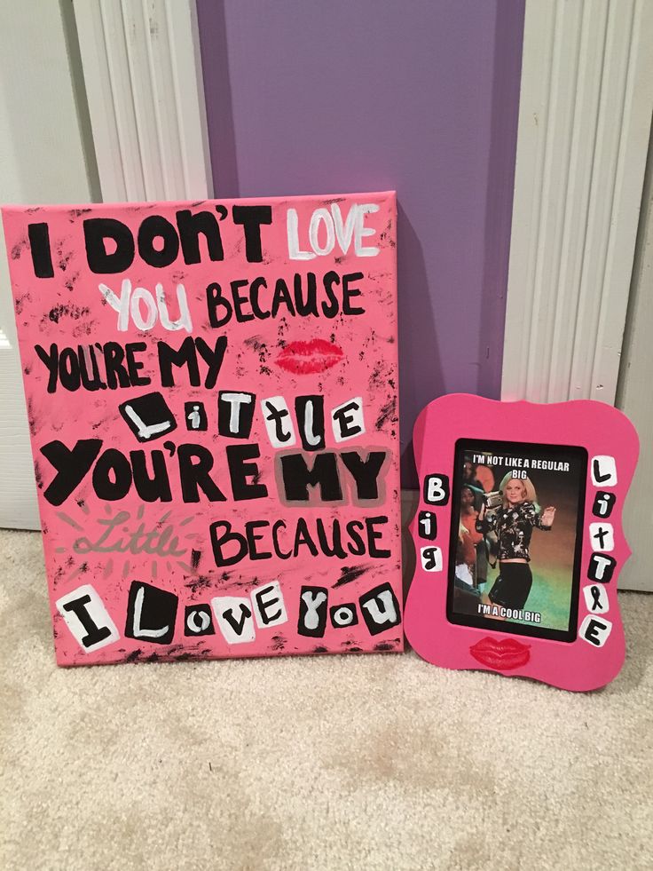 a couple of pink frames sitting next to each other on top of a carpeted floor