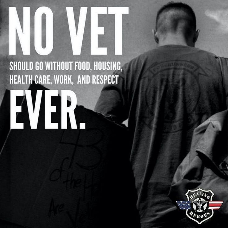 there is a man walking down the street with a sign on his back that says no vet should go without food, housing, health care work and respect