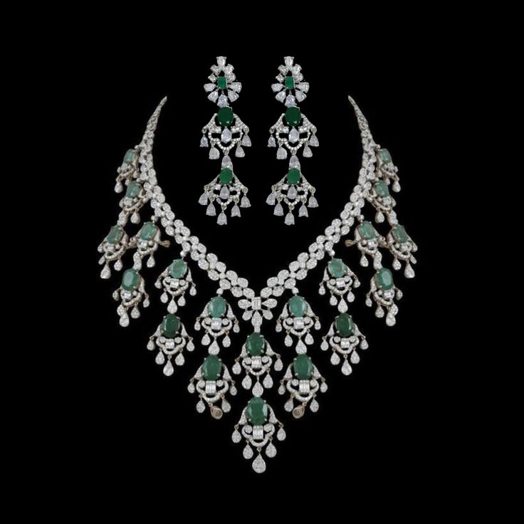 Emerald Necklace Set inspired by Sabyasachi, features a stunning green emerald paired with sparkling American diamonds and cubic zirconia.  Perfect for Indian weddings or special occasions, this statement piece adds a touch of elegance and luxury. An ideal gift for brides, it's a beautiful addition to any jewelry collection. *𝐏𝐑𝐎𝐃𝐔𝐂𝐓 𝐃𝐄𝐓𝐀𝐈𝐋* * 𝐌𝐚𝐭𝐞𝐫𝐢𝐚𝐥: Brass * 𝐏𝐥𝐚𝐭𝐢𝐧𝐠: White Rhodium Plated * 𝐒𝐭𝐨𝐧𝐞: AAA-quality CZ Diamond & Emerald. *𝐃𝐈𝐌𝐄𝐍𝐒𝐈𝐎𝐍𝐒* *𝐍𝐞𝐜 Arzano Jewellery, Festive Green Emerald Necklace For Reception, Formal Festive Emerald Necklace, Festive Formal Emerald Necklace, Luxury Emerald Bridal Necklace For Wedding, Green Diamond Bridal Necklace For Celebration, Traditional Green Emerald Necklace With Diamonds, Festive Green Diamond Bridal Necklace, Luxury Green Necklace For Wedding