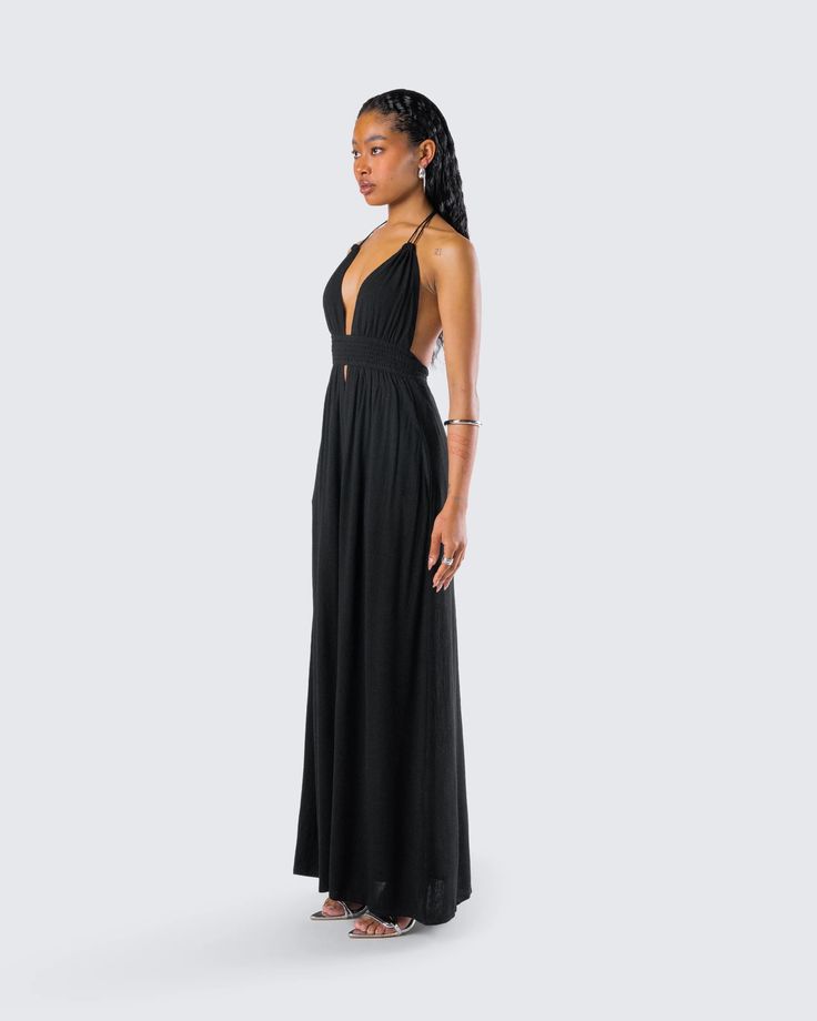 Leida Black Halter Maxi Dress – FINESSE Chic V-neck Beach Dress With Tie Back, Summer V-neck Dress With Elastic Back, Evening V-neck Maxi Dress With Smocked Back, V-neck Maxi Dress With Smocked Back For Vacation, Elegant Summer Dress With Elastic Back, Chic V-neck Tie Back Beach Dress, Elegant Ruched Backless Dress For Beach, Flowy V-neck Halter Dress With Tie Back, Elegant Backless Dress With Ruched Back For Beach