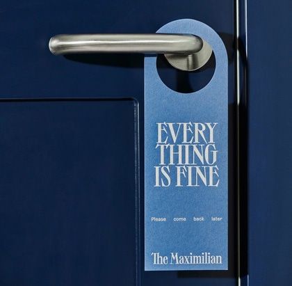 a door handle on a blue door with the words every thing is fine printed on it