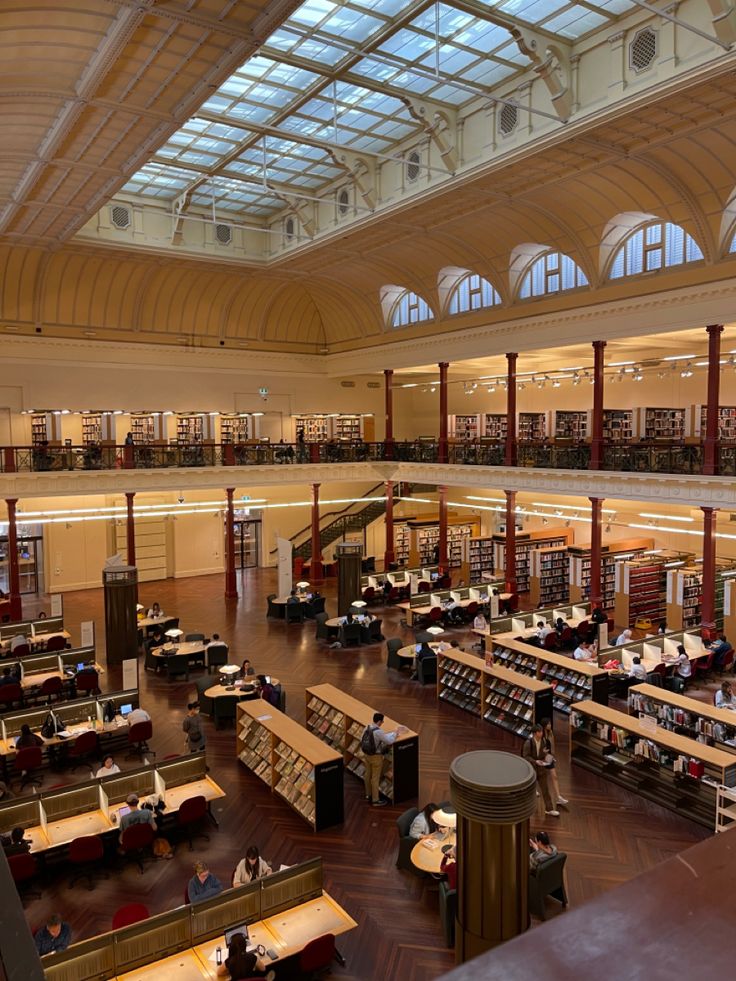 an overhead view of a library filled with lots of books and people sitting at tables