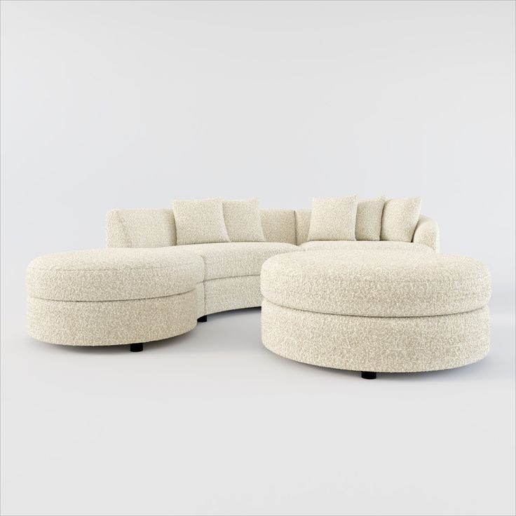 a white sectional couch sitting on top of a table