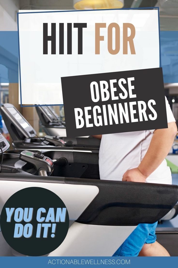 a man holding a sign that says hit for obese beginners you can do it