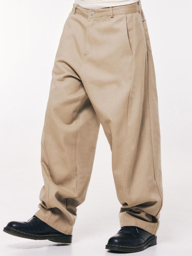 This is a casual and comfortable pants by THAT`S IT that is made out of high quality and sturdy fabric. With minimal design detail and trendy mood, you can style it for your casual and young daily outfit.- Voluminous wide silhouette- Curved detail on the leg- Minimal and relaxed mood Beige Wide Leg Pants With Belt Loops, Cream Wide-leg Pants With Belt Loops, Classic Straight Leg Streetwear Pants, Classic Straight Pants For Streetwear, Spring Workwear Bottoms With Boxy Fit, Boxy Fit Bottoms For Spring Workwear, Cream Straight Leg Pants With Welt Pockets, Relaxed Fit Wide Leg Pants In Khaki, Oversized High-waisted Work Pants